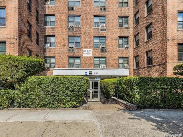 view of building exterior with cooling unit