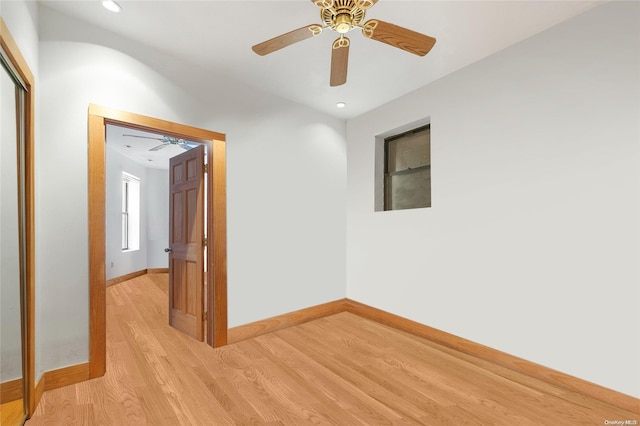 empty room featuring light wood-type flooring and ceiling fan