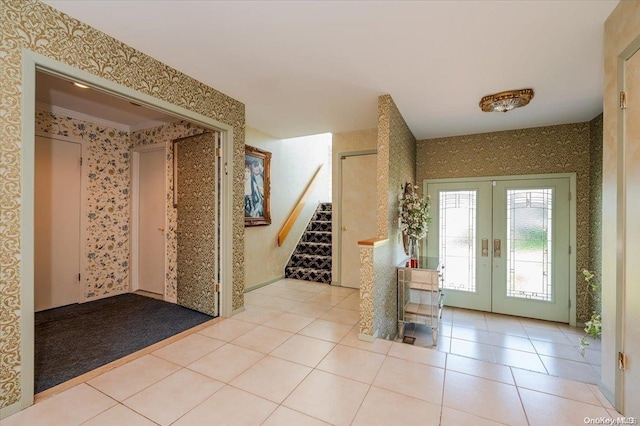 1233 Beech St Unit 35, Atlantic Beach, NY 11509 - foyer with french doors, wallpapered walls, stairway, and light tile patterned floors