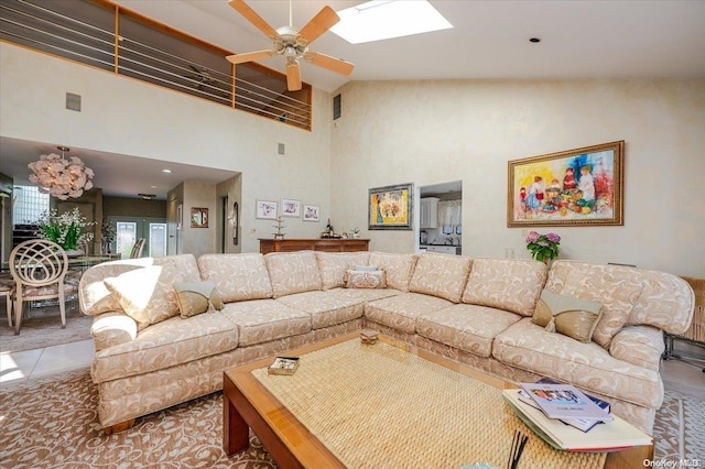 living room featuring ceiling fan and high vaulted ceiling