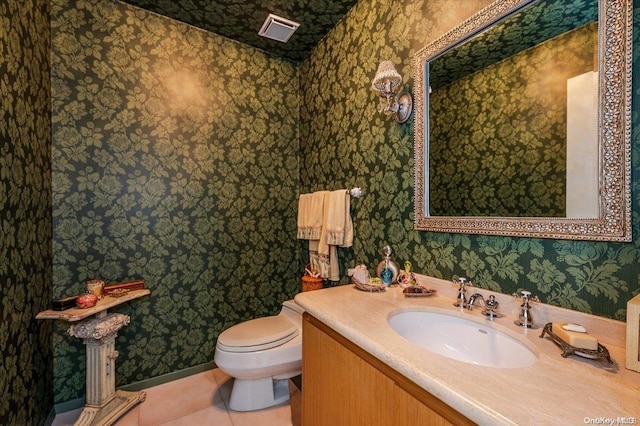 bathroom with tile patterned floors, toilet, and sink