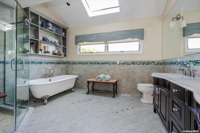 1233 Beech St Unit 35, Atlantic Beach, NY 11509 - full bath with vanity, tile walls, a freestanding bath, a shower stall, and toilet
