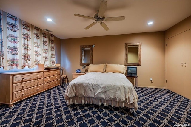 carpeted bedroom with a closet and ceiling fan