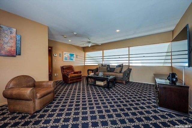 carpeted living room with ceiling fan