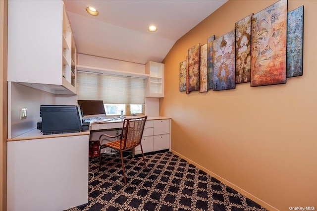 carpeted office featuring lofted ceiling