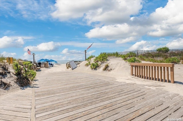 wooden deck with a water view