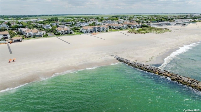 bird's eye view featuring a water view and a view of the beach