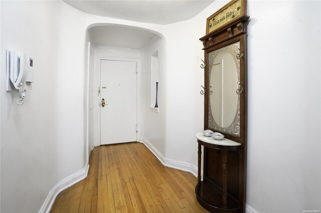 hall with light hardwood / wood-style floors