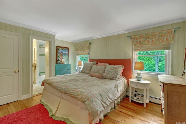 bedroom featuring ensuite bath, light hardwood / wood-style flooring, multiple windows, and crown molding