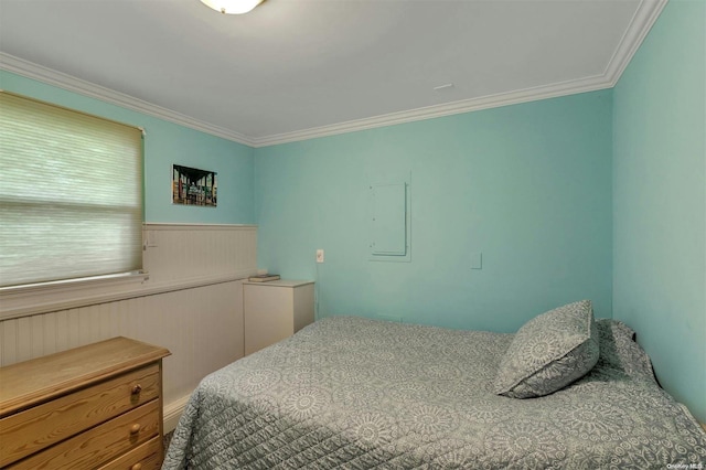 bedroom featuring crown molding and electric panel