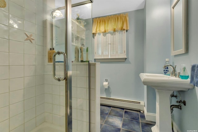 bathroom featuring an enclosed shower and a baseboard heating unit