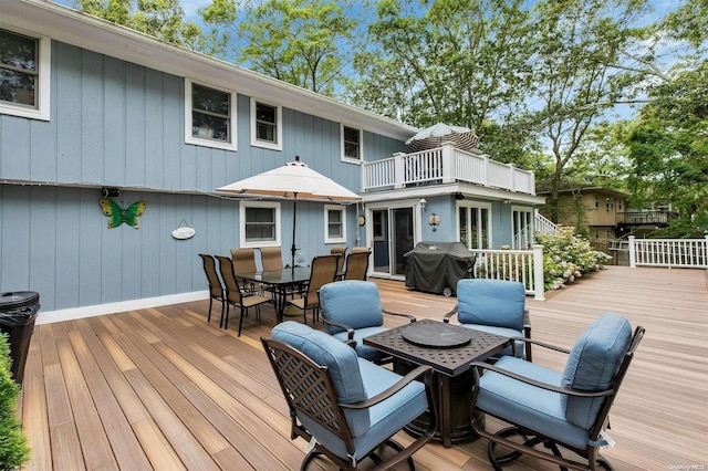 wooden terrace featuring area for grilling