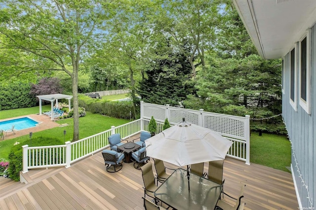 wooden terrace with a lawn