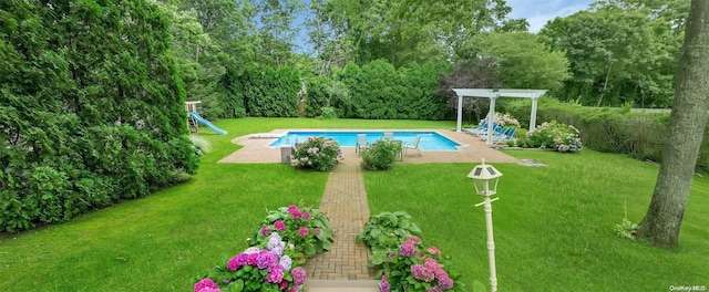 view of pool featuring a lawn and a pergola