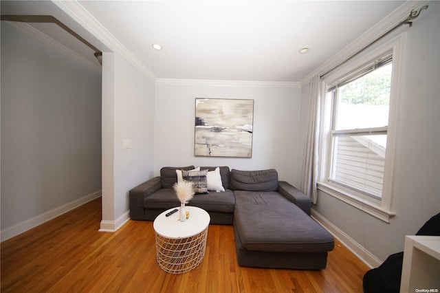 sitting room featuring hardwood / wood-style floors and ornamental molding