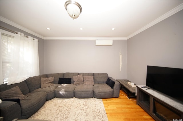 living room featuring hardwood / wood-style flooring, ornamental molding, and a wall mounted AC