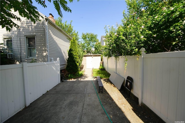 exterior space with a storage unit and a patio