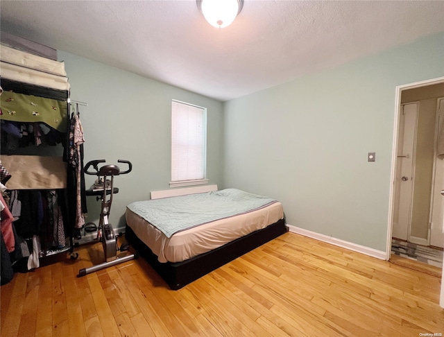 bedroom featuring hardwood / wood-style floors