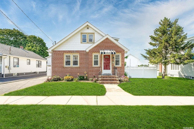 bungalow-style house featuring a front yard