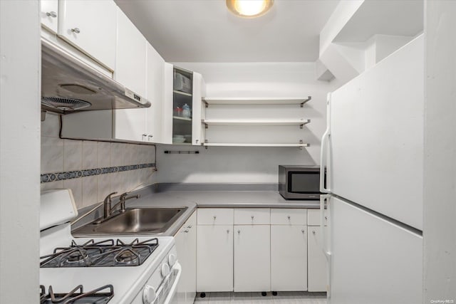 kitchen with white cabinetry, sink, white appliances, and backsplash