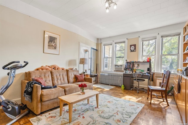 living room featuring radiator heating unit and parquet floors