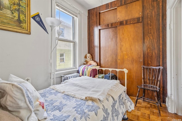 bedroom featuring parquet floors