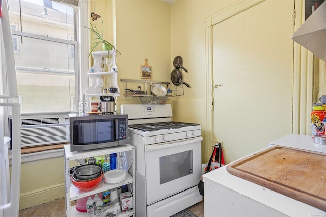 kitchen featuring white gas range