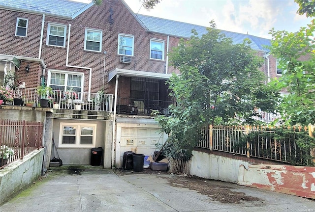 rear view of house with a garage