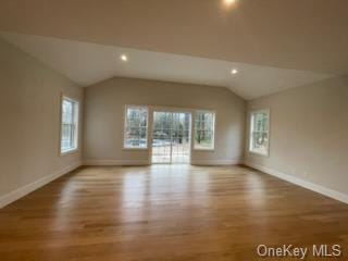 interior space featuring light hardwood / wood-style flooring and vaulted ceiling