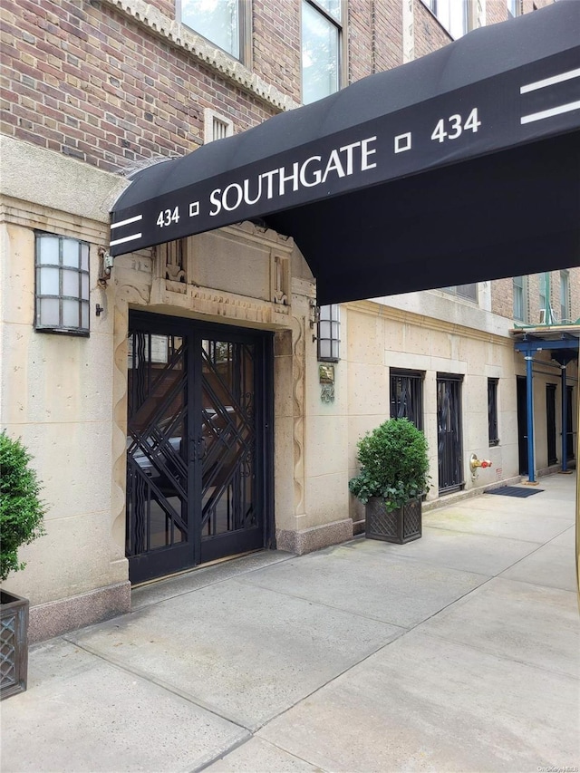 434 E 52nd St Unit 9A, New York Manhattan, NY 10022 - doorway to property featuring brick siding and stone siding