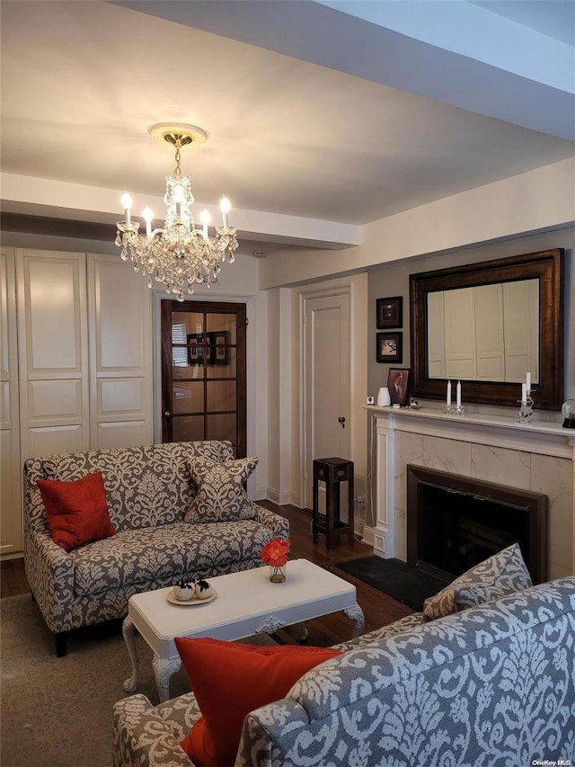 434 E 52nd St Unit 9A, New York Manhattan, NY 10022 - living room featuring a chandelier, a fireplace, and baseboards