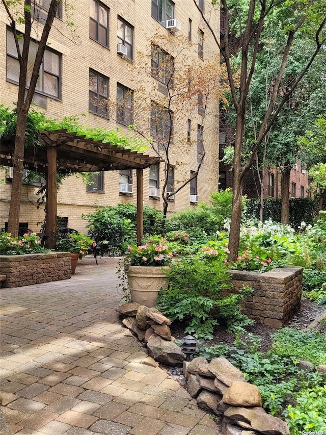 view of home's community with a pergola