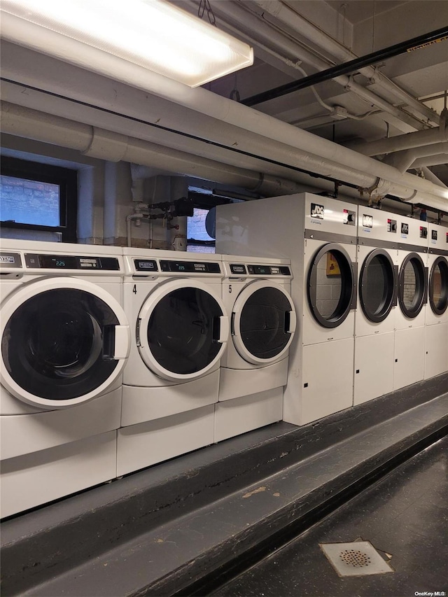 laundry area featuring washing machine and clothes dryer