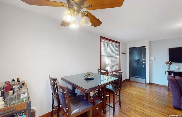 dining room featuring ceiling fan and light hardwood / wood-style floors