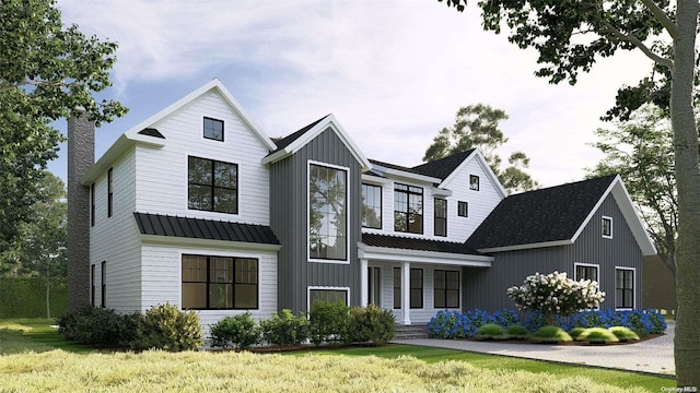 modern inspired farmhouse featuring a porch and a front lawn