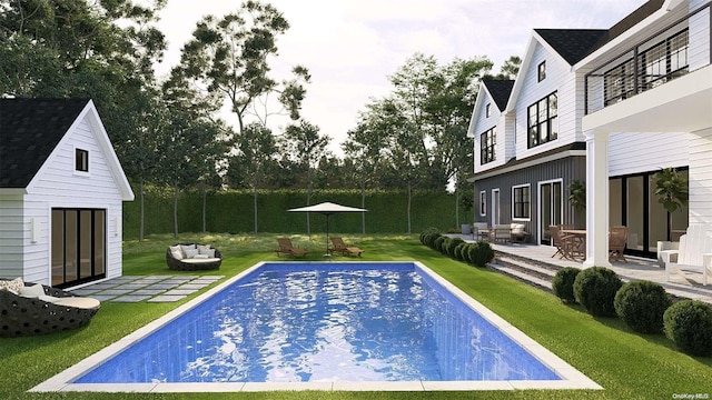 view of pool with a patio area, an outbuilding, and a yard