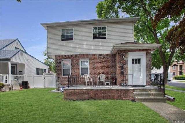 front facade with a front lawn