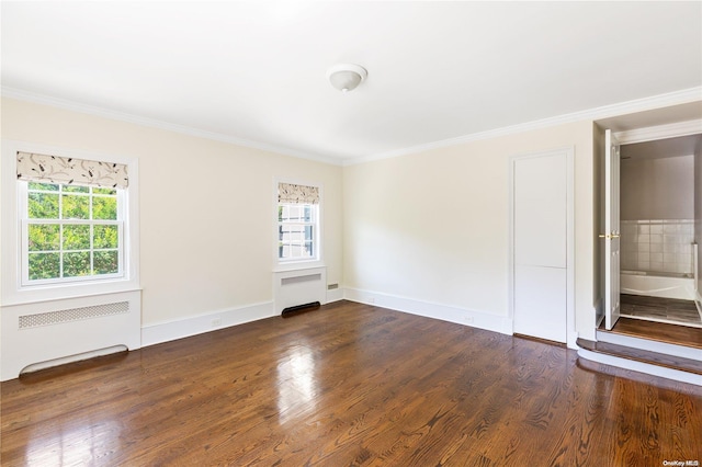 unfurnished room featuring dark hardwood / wood-style flooring, radiator heating unit, and ornamental molding