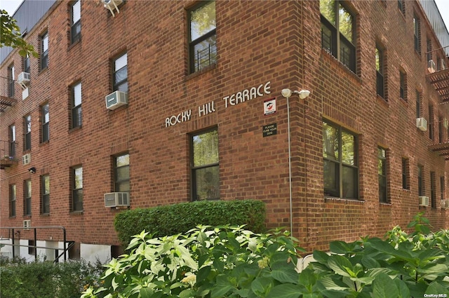 view of building exterior with cooling unit