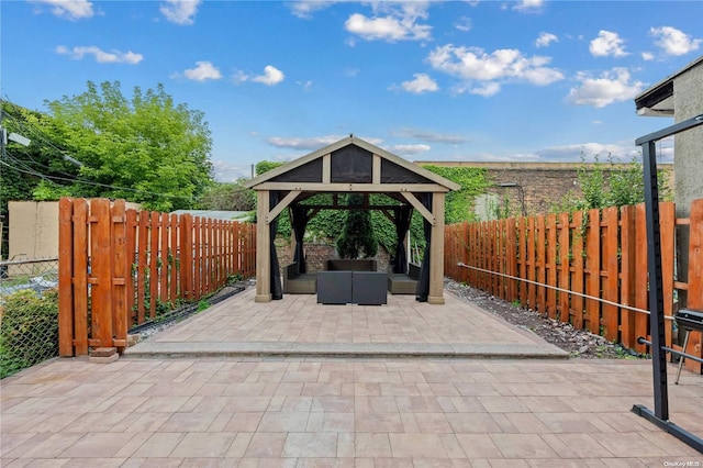 view of patio with a gazebo and an outdoor living space