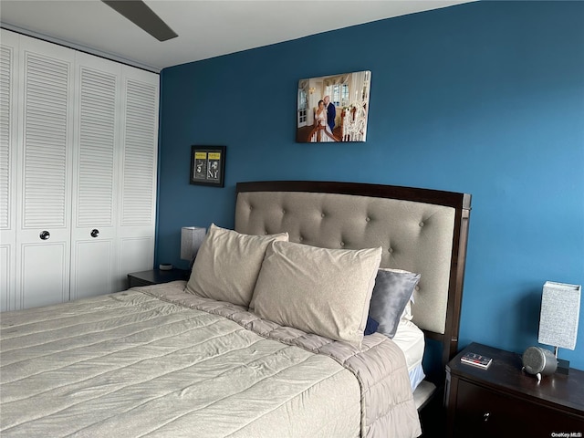 bedroom with ceiling fan and a closet