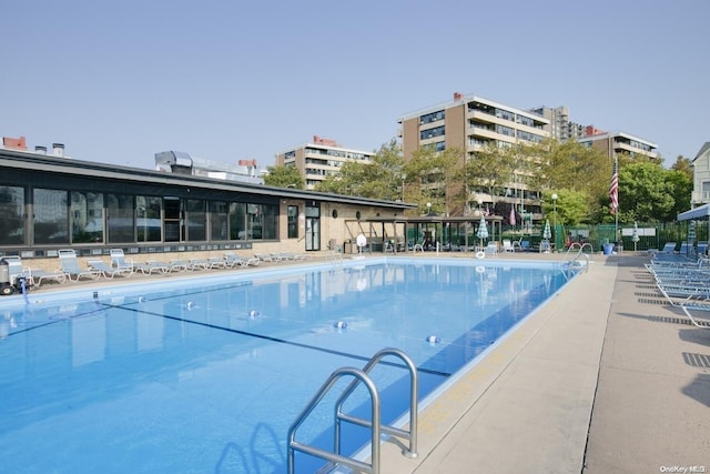 view of swimming pool featuring a patio area