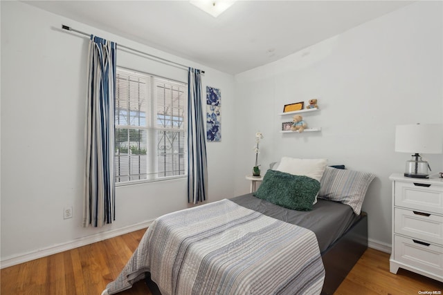 bedroom with light hardwood / wood-style flooring