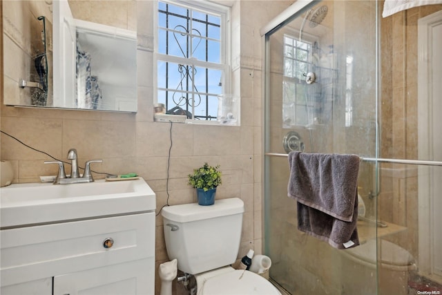 bathroom featuring vanity, toilet, tile walls, tasteful backsplash, and an enclosed shower