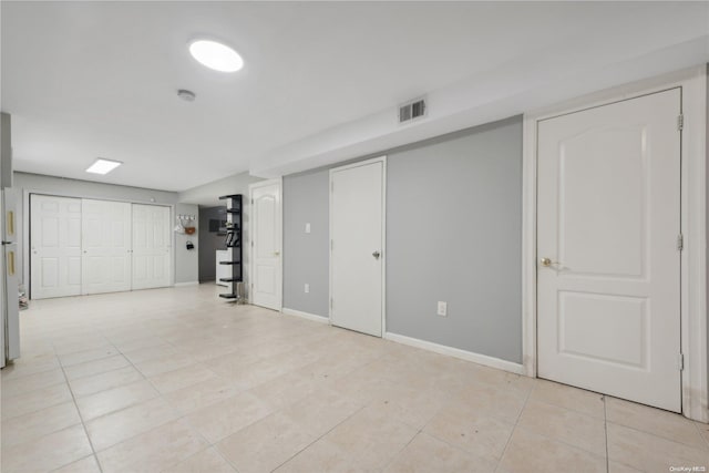 basement with light tile patterned floors