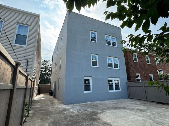 back of property featuring a patio area