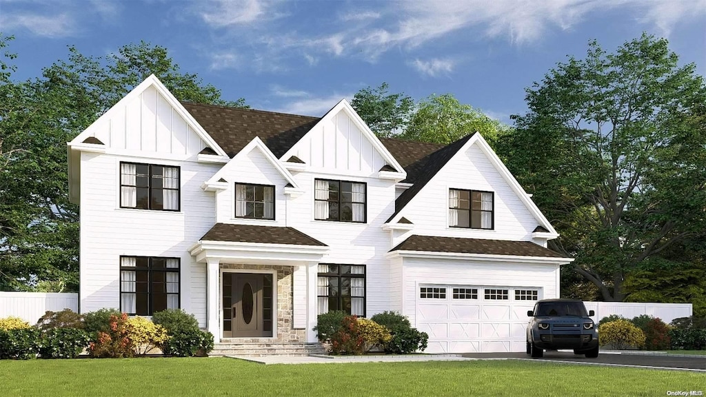 view of front facade featuring a garage and a front lawn