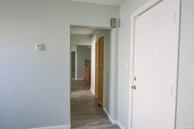 corridor featuring hardwood / wood-style floors