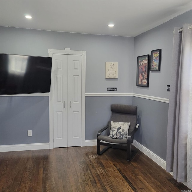 living area with dark hardwood / wood-style floors