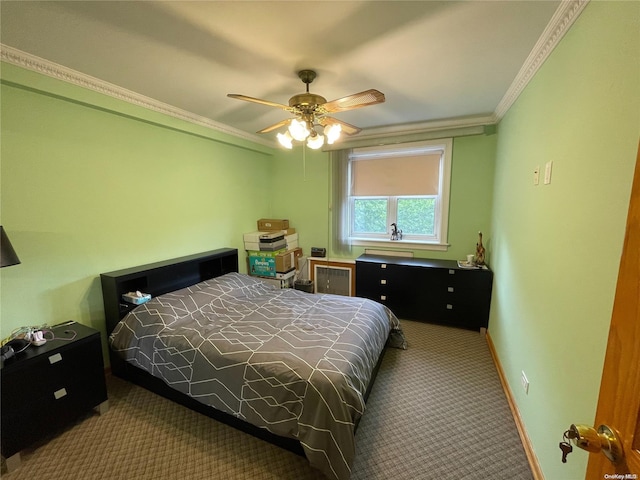 carpeted bedroom with ceiling fan and ornamental molding